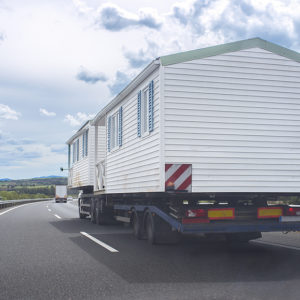 pre fabricated house on a move to its permanent location